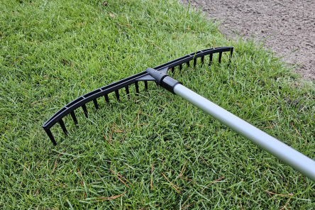golf course bunker rakes with built in stand
